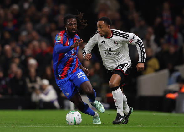 28th October 2026; Craven Cottage, London, England; Carabao Cup Football, Fulham versus Crystal Palace; Kenny Tete of Fulham under pressure from Evann Guessand of Crystal Palace JohnxPatrickxFletcher