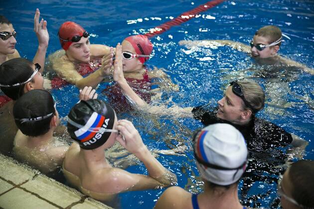 Swimming, Charlene, Princess of Monaco, gives swimming lessons to children