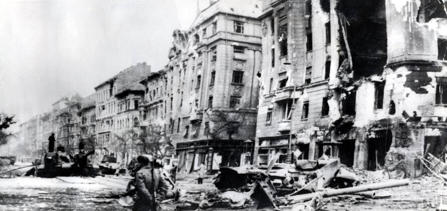 Oct 31, 1956 - Budapest, Hungary - The Hungarian Revolution of 1956 was a spontaneous nationwide revolt against the Stalinist government of Hungary and its Soviet-imposed policies, lasting from 23 October until 10 November 1956. It began as a student demonstration which attracted thousands as it marched through central Budapest to the Parliament building. After the revolt spread quickly across Hungary, and the government fell, thousands organized into militias, battling the State Security Police and Soviet troops. On 4 November, a large Soviet force invaded Budapest. By January 1957, the new Soviet-installed government had suppressed all public opposition. PICTURED: Panorama of Baross Street - ruins and destroyed soviet tanks. Budapest Hungary  - ZUMAk09