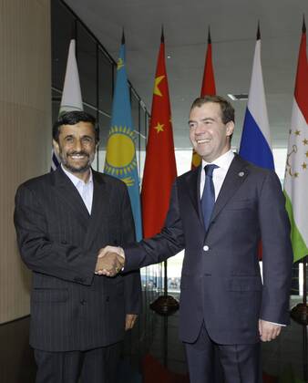 ITAR-TASS 13: YEKATERINBURG, RUSSIA. JUNE 16, 2009. President of Russia Dmitry Medvedev and President of Iran Mahmoud Ahmadinejad (L) appear prior to a narrow format summit meeting of the Shanghai Cooperation Organization (SCO) member states and SCO observer states.  Highlight 1002122