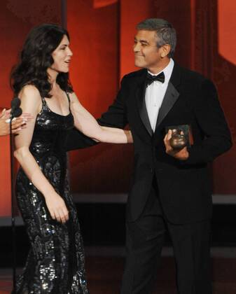 George Clooney accepts the Bob Hope Humanitarian Award from presenter Julianna Margulies , during the 62nd annual Primetime Emmy Awards at the Nokia Theatre in Los Angeles on August 29, 2010.  LAP20100829615