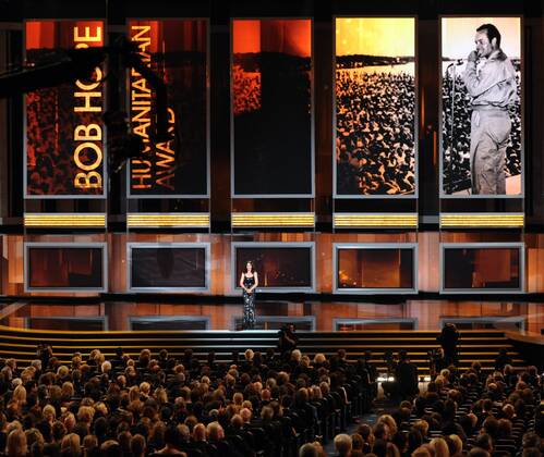 Presenter Julianna Margulies introduces actor George Clooney as this year s recipient of the Bob Hope Humanitarian Award during the 62nd annual Primetime Emmy Awards at the Nokia Theatre in Los Angeles on August 29, 2010.  LAP20100829999
