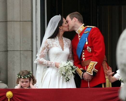 . . Royal Wedding Prince William of Wales and Catherine Kate Middleton . . 29.04.11 Prince William Duke of Cambridge, Catherine Duchess of Cambridge kiss on the balcony of Buckingham Palace as bridesmaid Grace van Cutsem covers her ears. The Royal Wedding takes place today of Prince William and Kate Middleton at Westminster Abbey, London. 