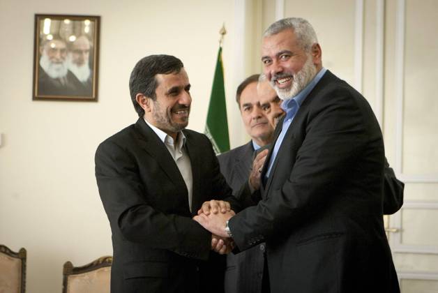 (120212) -- TEHRAN, Feb. 12, 2012 (Xinhua) -- Iranian President Mahmoud Ahmadinejad (L) shakes hands with visiting Hamas leader Ismail Haniyeh during their meeting in Tehran, capital of Iran, on Feb. 12, 2012. (Xinhua Ahmad Halabisaz) (nxl) IRAN-TEHRAN-AHMADINEJAD-HAMAS-HANIYEH-MEETING 