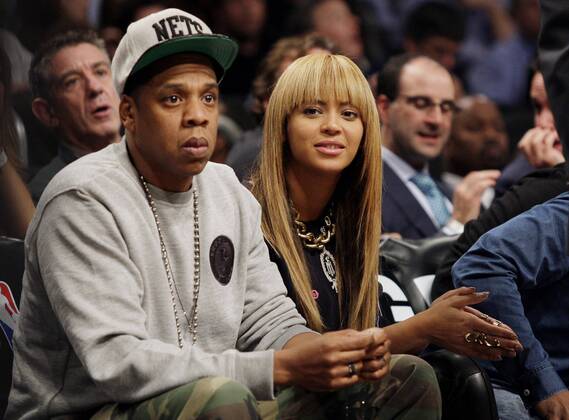 Beyonce and Jay-Z watch the Brooklyn Nets play the New York Knicks at the Barclays Center in New York City on November 26, 2012.  NYP20121126130