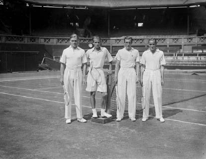 Members of the English Davis Cup team are practising at Wimbledon for the Challenge Round against the Americans tomorrow Photo shows the Davis Cup team at Wimbledon - left to right C N B Tuckey with H W Austin and Fred Perry and G P Hughes 26th July 1935  UnitedArchives00953614