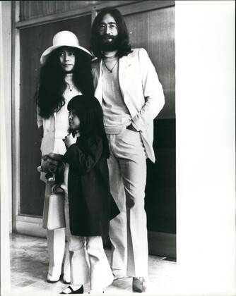 Dec. 12, 1980 - John Lennon Shot Dead: Former Beatles John Lennon was shot dead at his apartment in New York City Last Night. Photo Shows John Lennon and his wife Yoko Ono with her daughter by her previous marriage Yoko Pictured at London Airport in May 1969 leaving for his ~ to stage a seven day Bed-in- for-peas . This was their second Bed-in their first was held a month previously in Amsterdam. Lennon chose the Be hams as the nearest British settlement to the U.s. -he had been refused a U.s. visa because of a drug conviction.  - ZUMAk09