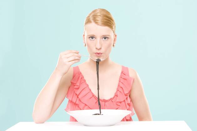 Woman eating noodles, portrait model released  CLF00453