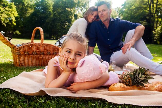 Portrait of little girl with her parents sitting in the background model released Symbolfoto  CHAF000140