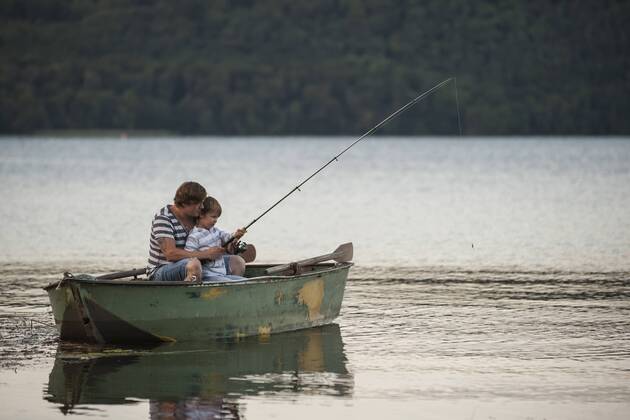 Germany, Rhineland-Palatinate, Laacher See, father and son fishing from boat model released Symbolfoto  PAF000916