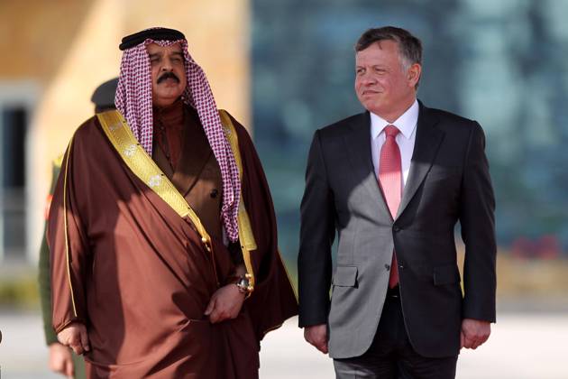 King Abdullah II of Jordan (R) inspects guards of honor with visiting King Hamad bin Isa Al Khalifa of Bahrain in Amman, capital of Jordan, on Feb. 9, 2015. ) JORDAN-AMMAN-BAHRAIN-VISIT MohammadxAbuxGhosh 