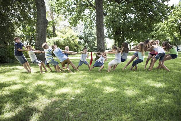 Boys and girls competing in tug of war model released Symbolfoto property released  ZEF002825