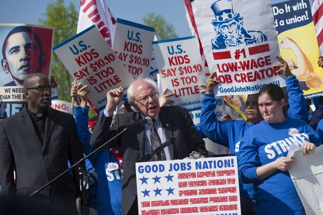 Senator Bernard Sanders (I-VT) speaks alongside protesters advocating for an increase in the minimum wage to $15 per hour, as part of a Fight for $15 rally on Capitol Hill, in Washington, D.C. on April 22, 2015.  WAP20150422317 KEVINxDIETSCH