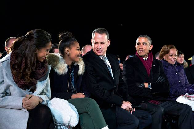 Dec. 4, 2014 - Washington, DC, United States of America - Actor Tom Hanks jokes with Malia and Sasha as President Barack Obama looks on at the National Christmas Tree lighting ceremony on the Ellipse December 4, 2014 in Washington, D.C. Washington United States of America - ZUMAp138