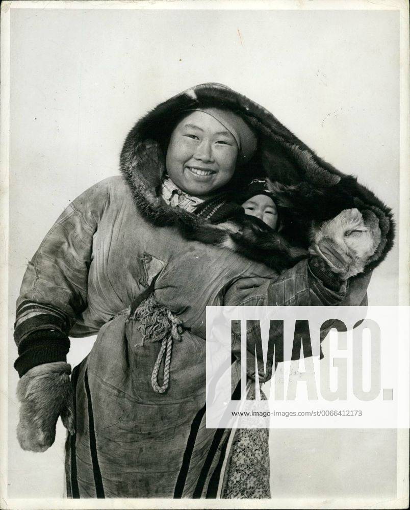 1950 Canada The Eskimo Baby Is Carried In A Parka Like Hood Next To The Mother S Skin And Is Kept Wa 1950 Canada The Eskimo Baby Is Carried In A Parka Like Hood Next To The Mother S Skin And Is Kept Wa