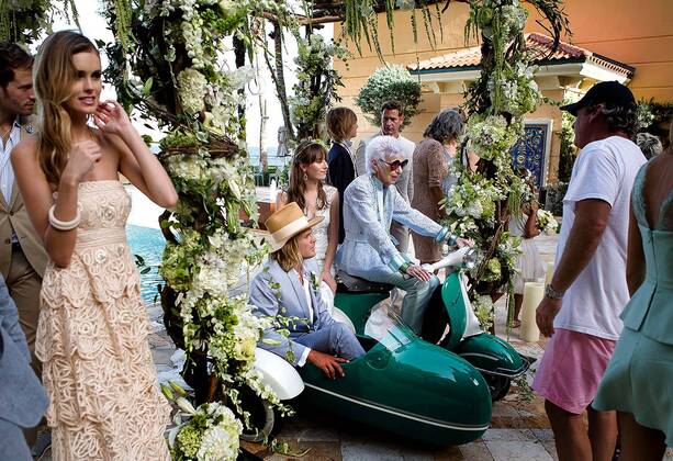 IMAGO ICONS: Iris Apfel Aug. 21, 2014 - Manalapan, Florida, U.S. - Fashion icon and former interior designer Iris Apfel, 93, center, sits on a Vespa during a photo shoot for a new advertising campaign at Eau Spa Palm Beach on Tuesday, August 19, 2014 in Manalapan. - ZUMAp77