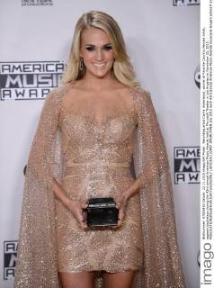 Recording artist Carrie Underwood, winner of Favorite Country Female Artist, appears backstage during the 43rd annual American Music Awards held at Microsoft Theater in Los Angeles on November 22, 2015.  LAP20151122437 JIMxRUYMEN