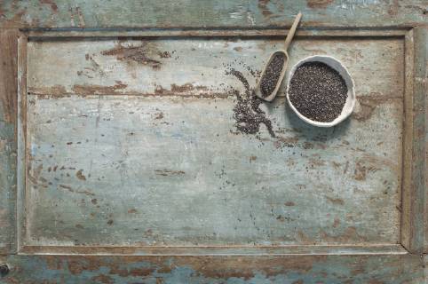 Chia seeds in bowl, shovel on wood  ASF005786