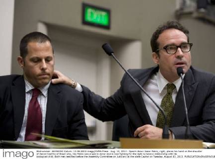 Aug. 13, 2013 - Sperm donor Jason Patric, right, places his hand on the shoulder of Daniel Carillho of Brazil who, like Patric was a sperm donor and is now fighting for the right to have a relationship with his biological child. Both men testified before the Assembly Committee on Judiciary at the state Capitol on Tuesday, August 13, 2013. - ZUMAs76