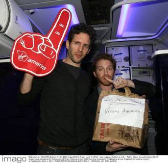 April 4, 2012 - Los Angeles, California, U.S. - Actors Glenn Howerton(L) and Seth Green board the plane for the Launch of Virgin America s first flight from Los Angeles to Philadelphia at Los Angeles International Airport on Wednesday April 4, 2012. - ZUMAc68_