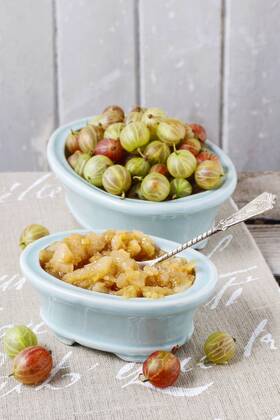 Bowls of gooseberries and jam. Healthy fruits  bew1B02F4E