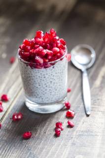 Glass of chia pudding with pomegranate seeds  SARF002515