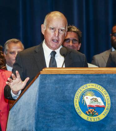 April 4, 2016 - Los Angeles, California, U.S - Governor Jerry Brown joins supporters from across the state in Los Angeles on Monday April 4, 2016, to sign landmark legislation passed by both houses of the Legislature last week Ã SB 3. The SB 3 makes California the first state in the nation to commit to raising the minimum wage to $15 per hour statewide. Under the plan, minimum wage will rise to $10.50 per hour on January 1, 2017 for businesses with 26 or more employees, and then rises each year until reaching $15 per hour in 2022. This plan also recognizes the contributions of small businesses Ã those with 25 or fewer employees Ã to California s economy and allows additional time for these employers to phase in the increases. Los Angeles U.S. - ZUMAc68_