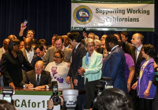 April 4, 2016 - Los Angeles, California, U.S - Governor Jerry Brown joins supporters from across the state in Los Angeles on Monday April 4, 2016, to sign landmark legislation passed by both houses of the Legislature last week SB 3. The SB 3 makes California the first state in the nation to commit to raising the minimum wage to $15 per hour statewide. Under the plan, minimum wage will rise to $10.50 per hour on January 1, 2017 for businesses with 26 or more employees, and then rises each year until reaching $15 per hour in 2022. This plan also recognizes the contributions of small businesses those with 25 or fewer employees to California s economy and allows additional time for these employers to phase in the increases. Los Angeles U.S. - ZUMAc68_