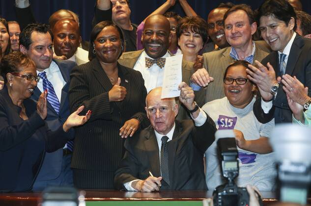 April 4, 2016 - Los Angeles, California, U.S - Governor Jerry Brown joins supporters from across the state in Los Angeles on Monday April 4, 2016, to sign landmark legislation passed by both houses of the Legislature last week Ã SB 3. The SB 3 makes California the first state in the nation to commit to raising the minimum wage to $15 per hour statewide. Under the plan, minimum wage will rise to $10.50 per hour on January 1, 2017 for businesses with 26 or more employees, and then rises each year until reaching $15 per hour in 2022. This plan also recognizes the contributions of small businesses Ã those with 25 or fewer employees Ã to California s economy and allows additional time for these employers to phase in the increases. Los Angeles U.S. - ZUMAc68_