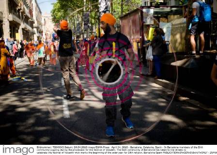 April 24, 2016 - Barcelona, Catalonia, Spain - In Barcelona members of the Sikh community juggling during the procession for the festival of Vaisakhi. The Sikh community of Barcelona has taken to the streets to celebrate the festival of Vaisakhi wich marks the beginning of the solar year for Sikh religion. Barcelona Spain - ZUMAb137