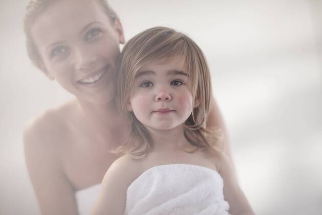 Smiling young woman and little girl wrapped in a towel model released Symbolfoto property released  ZEF009606