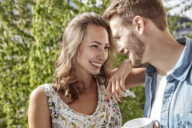 Happy couple in love on balcony model released Symbolfoto property released FMKF03148