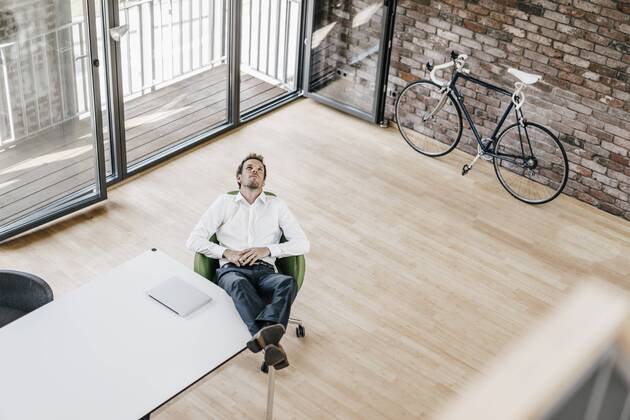 Businessman thinking in office model released Symbolfoto property released  KNSF00506
