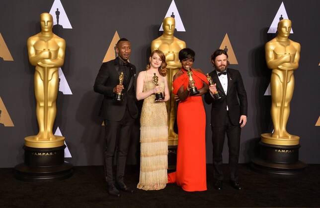 (L-R) Actors Mahersala Ali, winner of the award for Actor in a Supporting Role for Moonlight , Emma Stone, winner of the award for Actress in a Leading Role for La La Land , Viola Davis, winner of the award for Actress in a Supporting Role for Fences , and Casey Affleck, winner of the award for Actor in a Leading Role for Manchester by the Sea appear backstage during the 89th annual Academy Awards at Loews Hollywood Hotel in the Hollywood section of Los Angeles on February 26, 2017.  LAP201702261055 JIMxRUYMEN