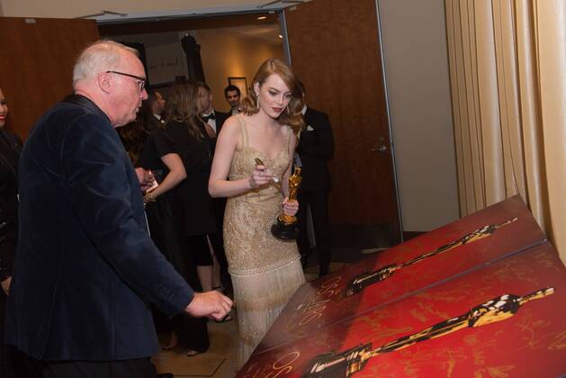 Feb 26, 2017 - Hollywood, California, U.S - EMMA STONE, Oscar winner for Best Performance by an actress in a Leading role, signs an official Oscars poster backstage The 89th Oscars at the Dolby Theatre in Hollywood, CA on Sunday, February 26, 2017. Hollywood U.S. - ZUMAz03_ 20170226_sho_z03_632 Copyright: xRobertxGladdenx