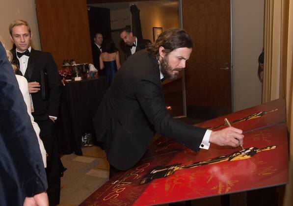 Feb 26, 2017 - Hollywood, California, U.S - CASEY AFFLECK, Oscar winner for Best Performance by an actor in a Leading role, signs an official Oscars poster backstage The 89th Oscars at the Dolby Theatre in Hollywood, CA on Sunday, February 26, 2017. Hollywood U.S. - ZUMAz03_ 20170226_sho_z03_631 Copyright: xRobertxGladdenx