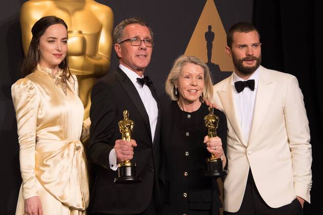 Feb 26, 2017 - Hollywood, California, U.S - David Wasco for Production Design and Sandy Reynolds-Wasco for Set Decoration pose backstage with the Oscar for Achievement in production design, for work on La La Landâ with presenters Dakota Johnson Jamie Dornan during the live ABC Telecast of The 89th Oscars at the Dolby Theatre in Hollywood, CA on Sunday, February 26, 2017. Hollywood U.S. - ZUMAz03_ 20170226_sho_z03_587 Copyright: xMikexBakerx
