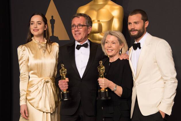 Feb 26, 2017 - Hollywood, California, U.S - David Wasco for Production Design and Sandy Reynolds-Wasco for Set Decoration pose backstage with the Oscar for Achievement in production design, for work on La La Landâ with presenters Dakota Johnson Jamie Dornan during the live ABC Telecast of The 89th Oscars at the Dolby Theatre in Hollywood, CA on Sunday, February 26, 2017. Hollywood U.S. - ZUMAz03_ 20170226_sho_z03_585 Copyright: xMikexBakerx