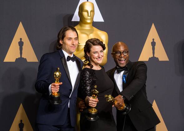(L-R) Producers Jeremy Kleiner, Adele Romanski and director Barry Jenkins, winners of Best Picture Moonlight , pose at press room of the 89th Academy Awards at the Dolby Theater in Los Angeles, the United States, on Feb. 26, 2017. ) (zjy) U.S.-LOS ANGELES-OSCAR-AWARD YangxLei 
