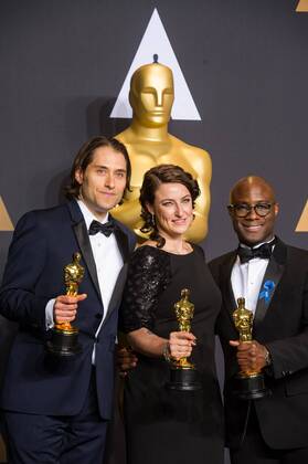 (L-R) Producers Jeremy Kleiner, Adele Romanski and director Barry Jenkins, winners of Best Picture Moonlight , pose at press room of the 89th Academy Awards at the Dolby Theater in Los Angeles, the United States, on Feb. 26, 2017. ) (zjy) U.S.-LOS ANGELES-OSCAR-AWARD YangxLei 