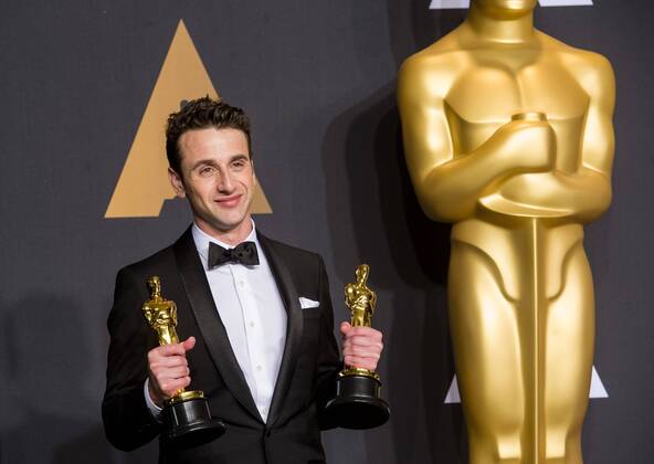 Justin Hurwitz poses after winning the Best Original Score award and the Best Original Song award for La La Land at press room of the 89th Academy Awards at the Dolby Theater in Los Angeles, the United States, on Feb. 26, 2017. )(zf) U.S.-LOS ANGELES-OSCAR-AWARD YangxLei 