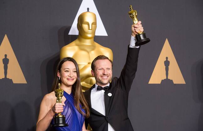 Producer Joanna Natasegara and director Orlando von Einsiedel pose after winning the Best Documentary Short Subject award for The White Helmets at press room of the 89th Academy Awards at the Dolby Theater in Los Angeles, the United States, on Feb. 26, 2017. )(zf) U.S.-LOS ANGELES-OSCAR-AWARD YangxLei 