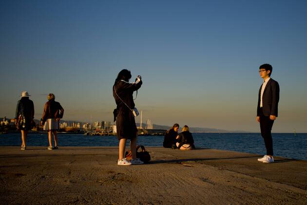 April 3, 2017 - Barcelona, Catalonia, Spain - In Barcelona people, most of them tourists, stand at the corner of a breakwater as the sun sets on this 3rd April, 2017. Barcelona Spain  - ZUMAn230 20170403_zaa_n230_130 Copyright: xJordixBoixareux