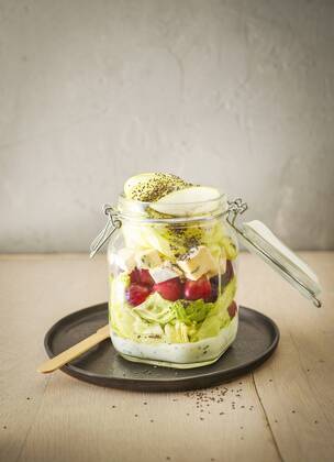 Preserving jar of iceberg salad with grapes, apple, blue cheese and chia seeds  KSWF01809
