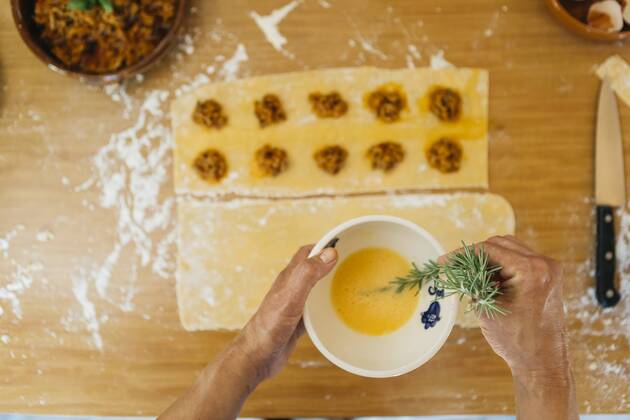 Woman preparing fresh ravioli, partial view model released Symbolfoto property released  JRFF01403
