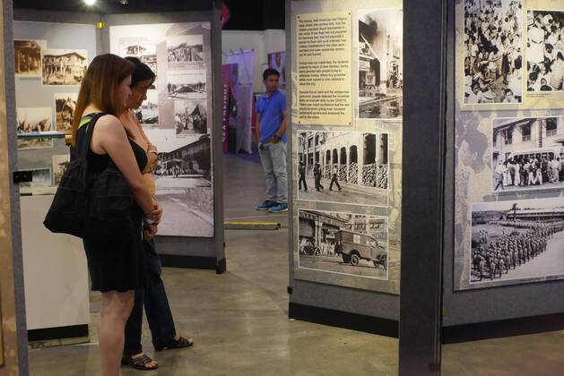 Philippines: HistoryCon 2017 Photo Exhibit of Japanese war being viewed by guests.  GeorgexBuid
