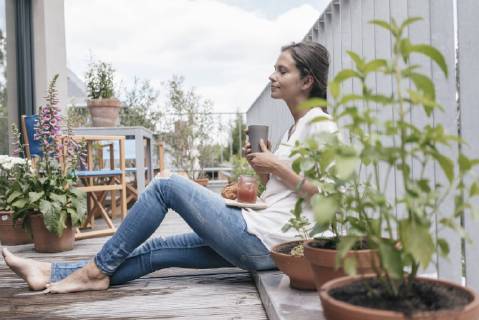 Woman relaxing on balcony model released Symbolfoto property released  JOSF01634