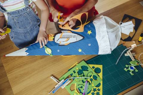 Mother and daughter creating her space themed school cone at home model released Symbolfoto property released  MFF03706