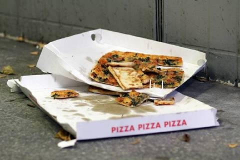 To-eat Pizza is on the Bottom a is with behind on the Bottom