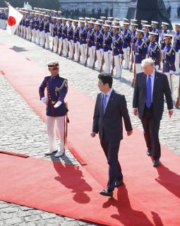 Trump in Japan Japanese Prime Minister Shinzo Abe (C) and U.S. President Donald Trump (R) receive a guard of honor at the State Guest House in Tokyo on Nov. 6, 2017.